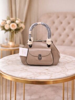 Early 2000s Beijo kisslock taupe